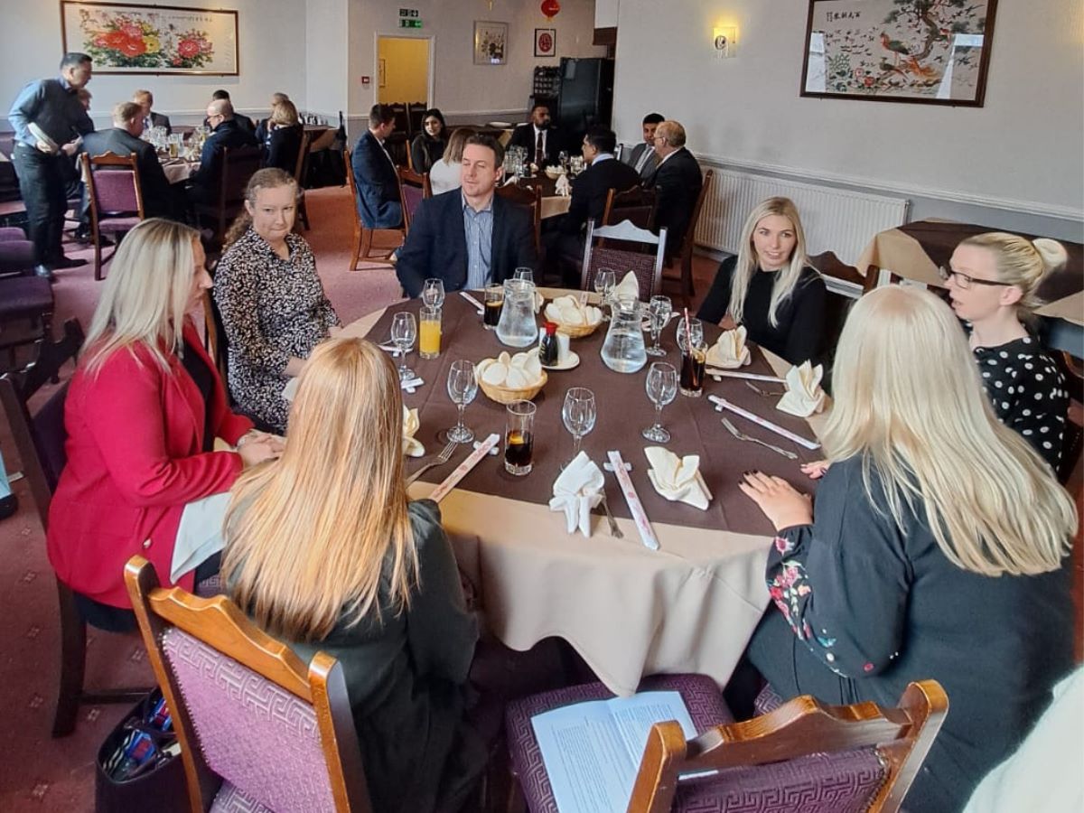 Business people talking around a table 